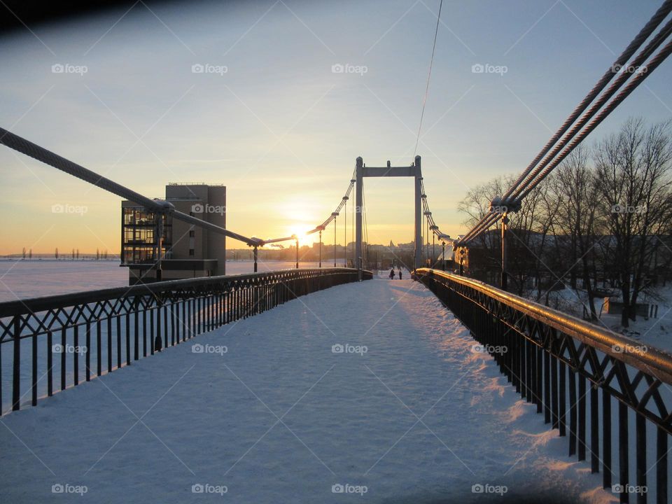 bridge river winter frost, the sun shines at sunset, but does not warm, Voronezh city, Russia