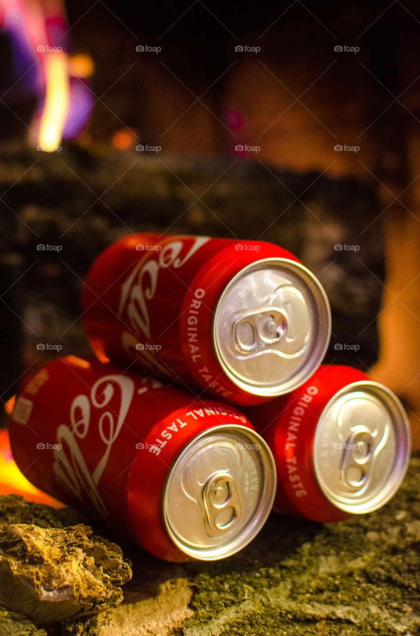 Enjoy a nice Coca-Cola in front of a warm fire