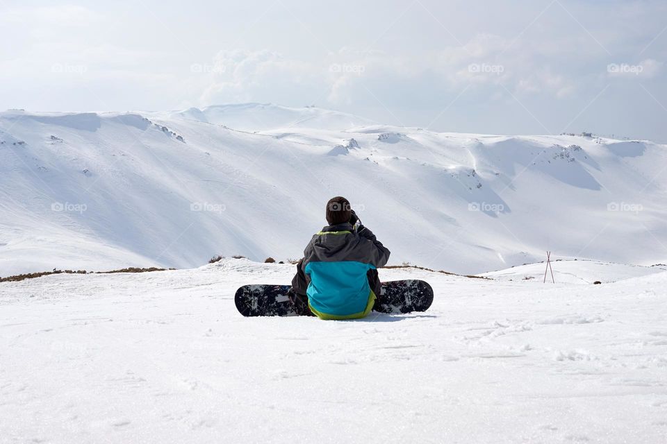 A snowboarder on the slope 