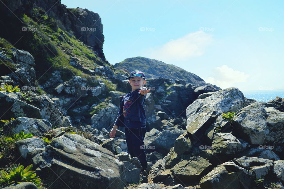 Boy and a rocky landscape