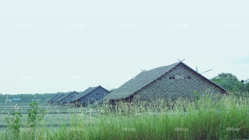 salt farm, hut, farm hut. salt farm hut near the sea at samutsakhon city thailand