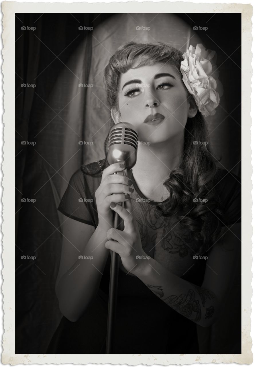Picture frame of woman with microphone