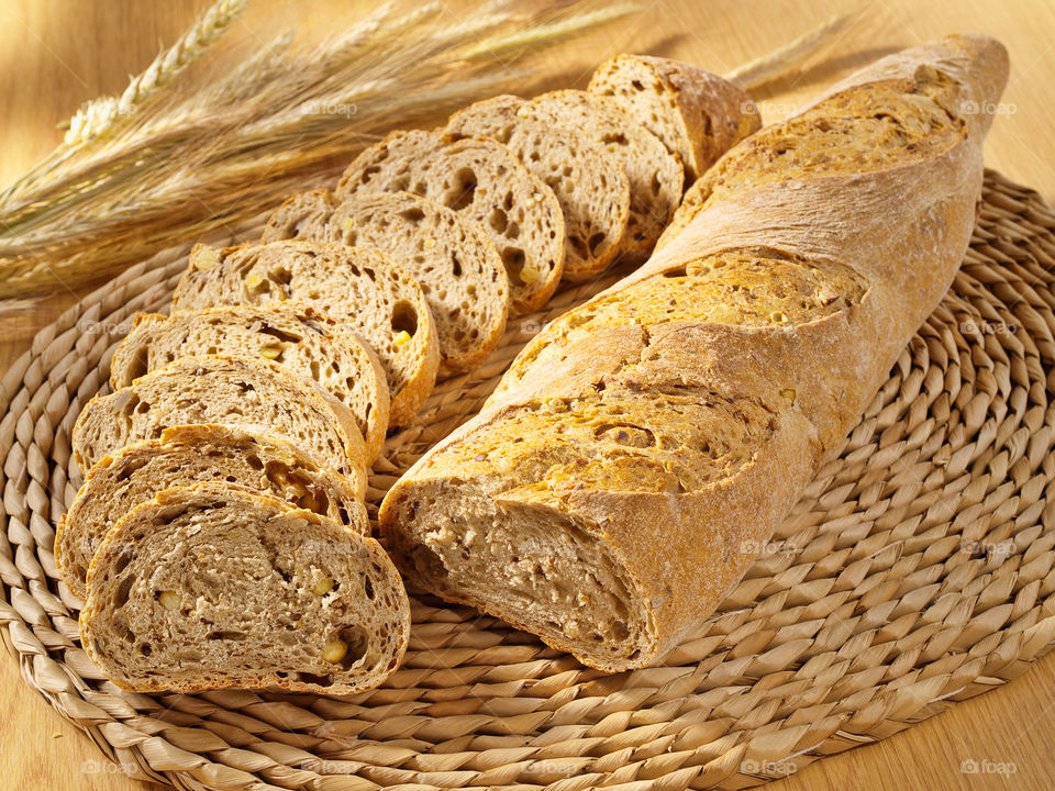 Bread with slices and wheat