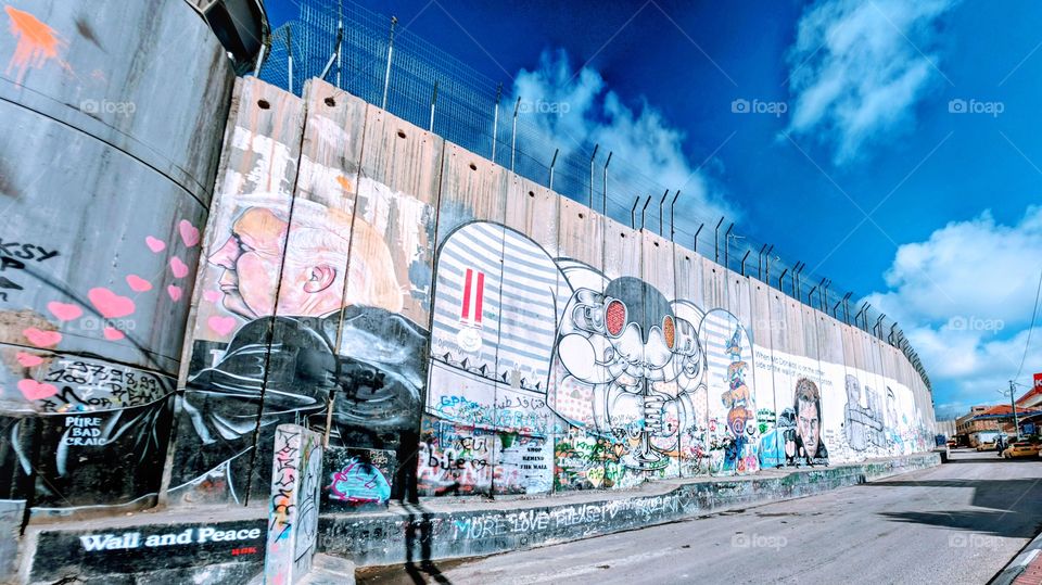 Bethlehem Graffiti Lampoons Trump's embrace of Israeli Wall
