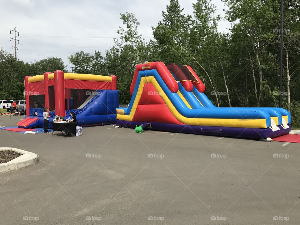 Two bouncy castles at Bower Ponds.