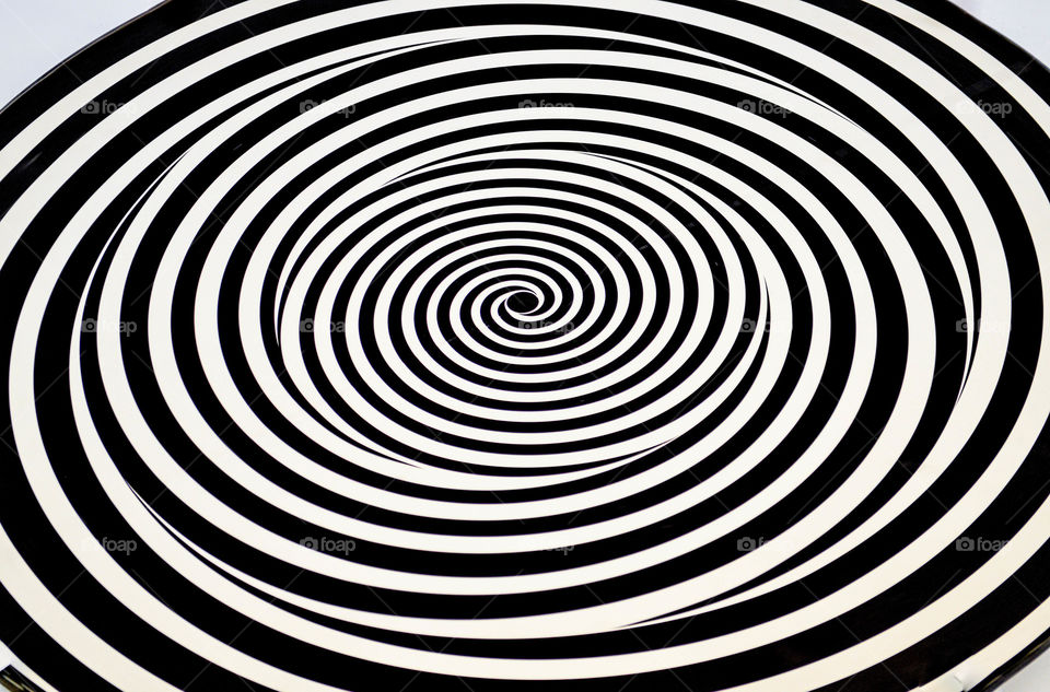 Black and white hypnotic spiral ellipse