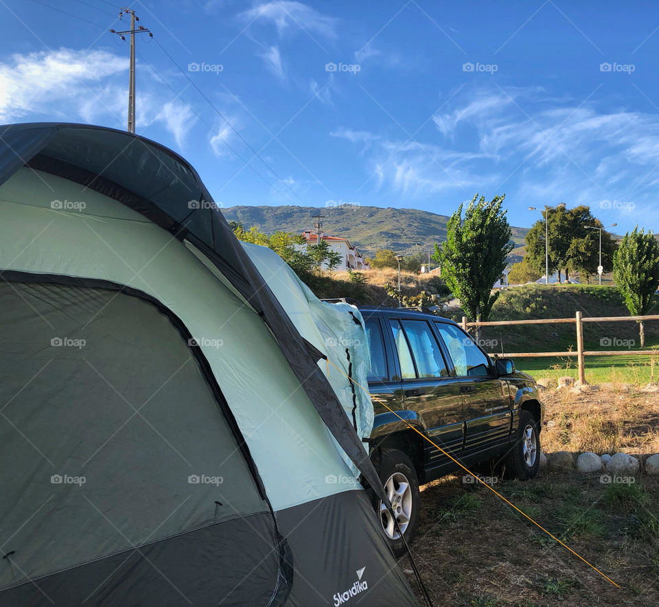 Jeep with tent extension parked in the Portuguese countryside 