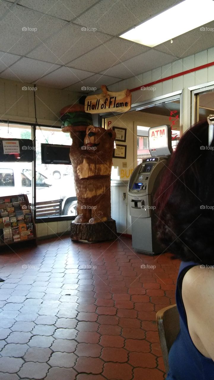 Carved Wooden Bear, Hall of Flame Burgers, Ruidoso, New Mexico. Local American Fast Food Joint in Southwest Village.