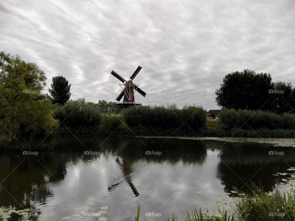 Dutch mill. Mill with waving clouds