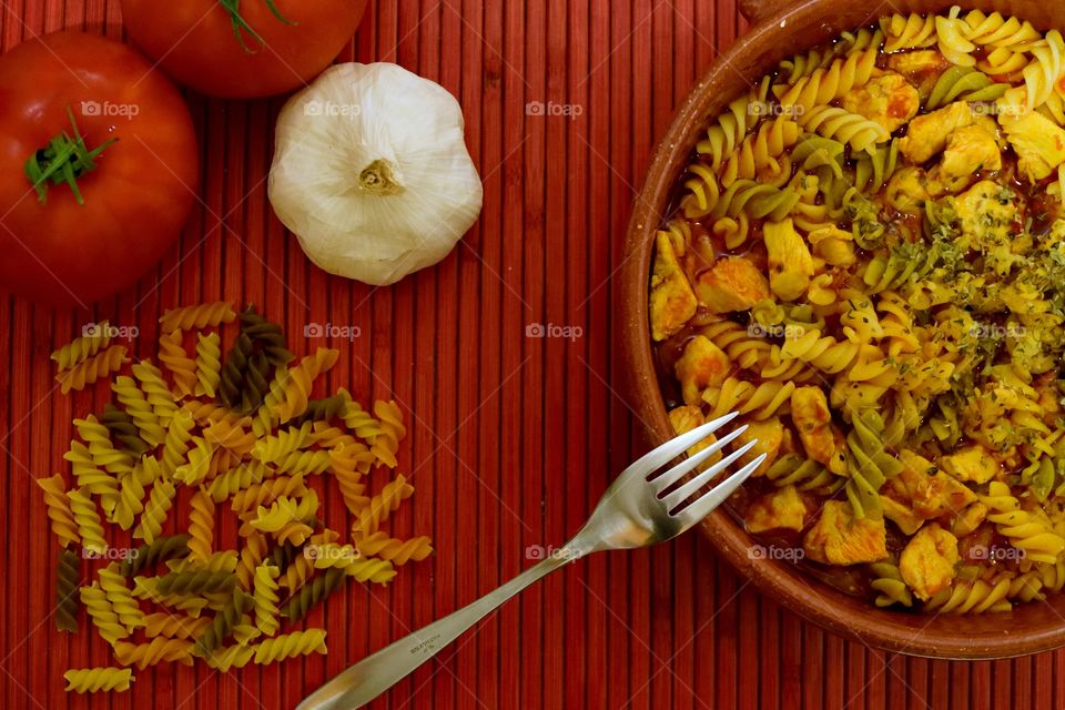 Making a dish of colourful pasta