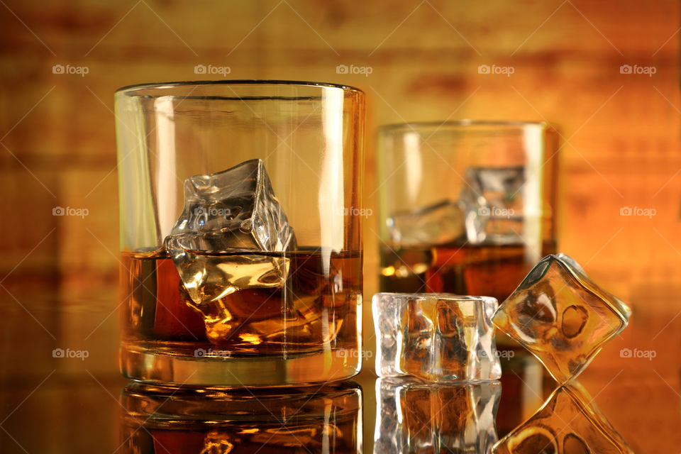 Whiskey Rum glasses with ice cubes