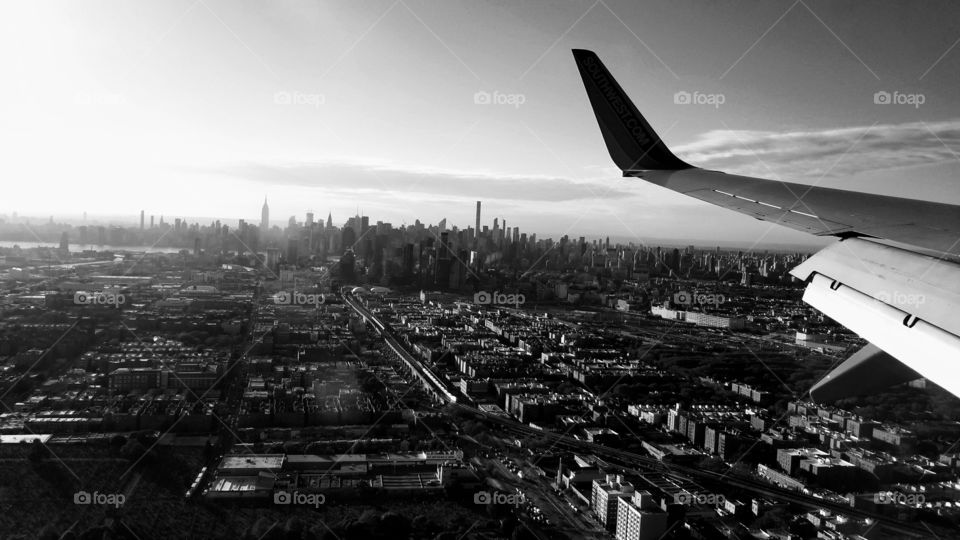 view from flight descending and landing into nyc