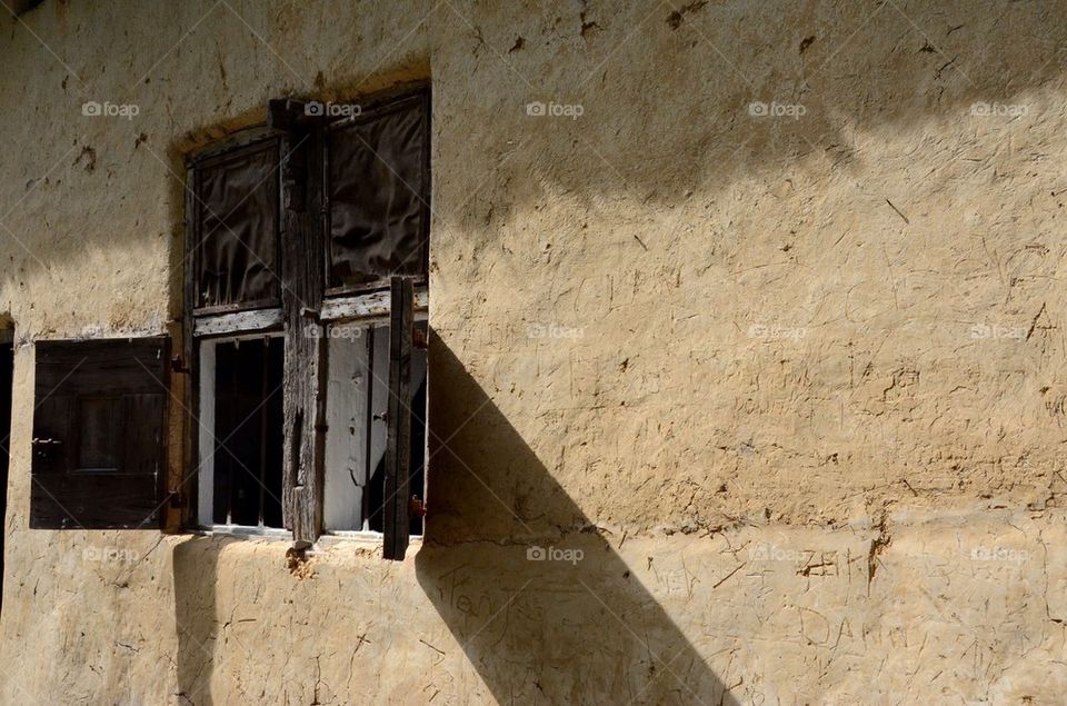 An old loam wall with window from an old farm.