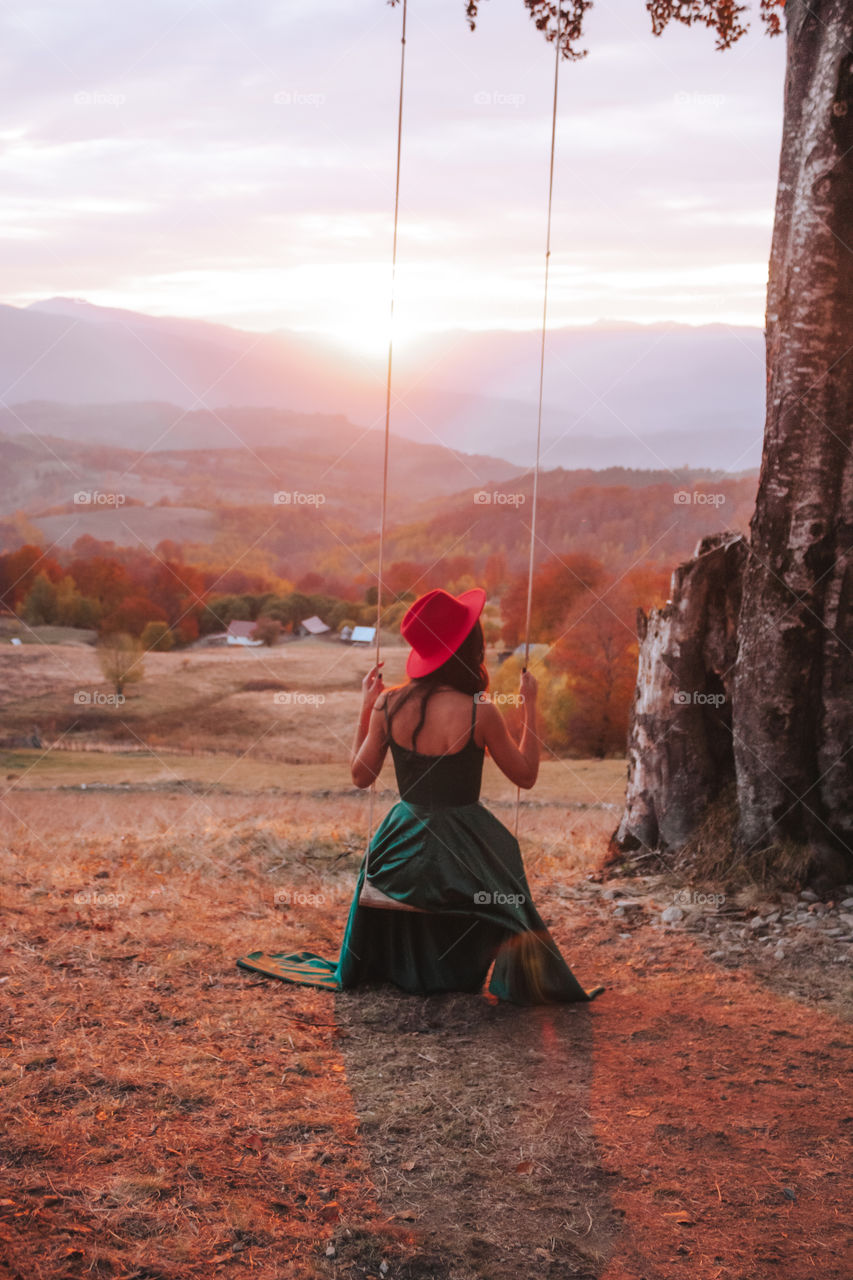 swinging in a stunning green dress