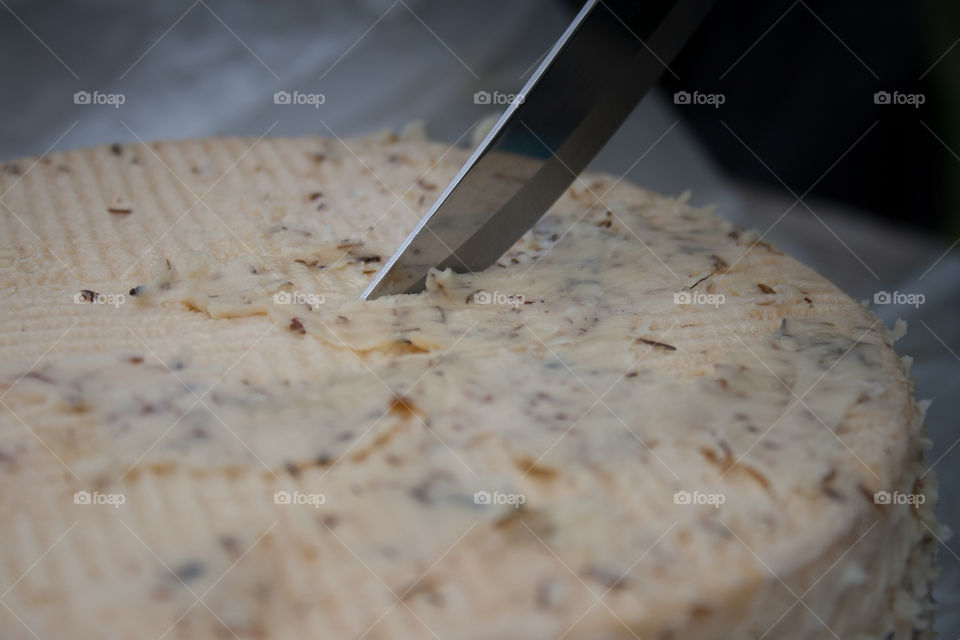 Opening cheese with knife 