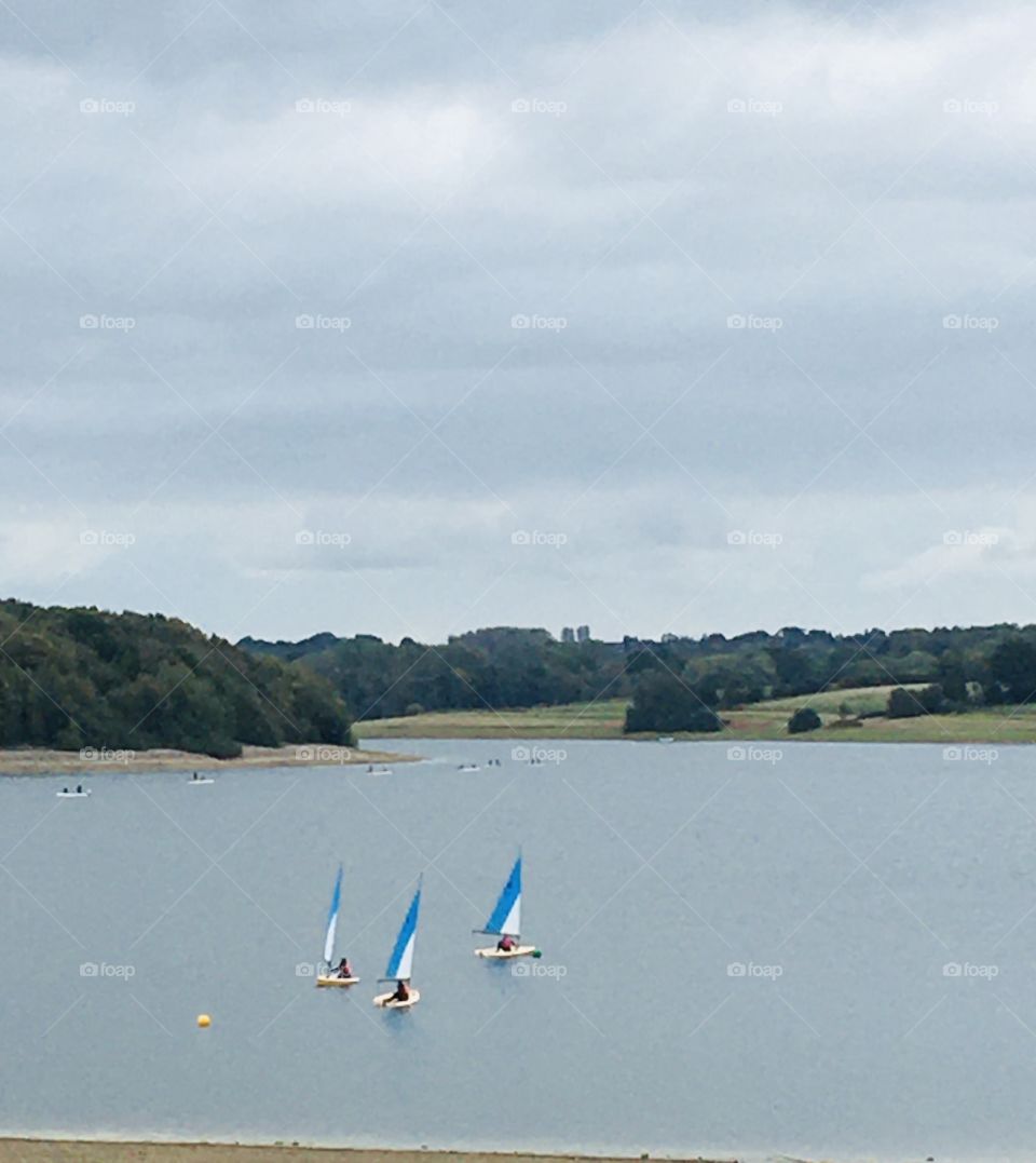 My lucky number - number 3! Three boats sailing across a lake. I think the number, colours and formation is rather eye catching. The beautiful scenery in the background is the Kent countryside. 