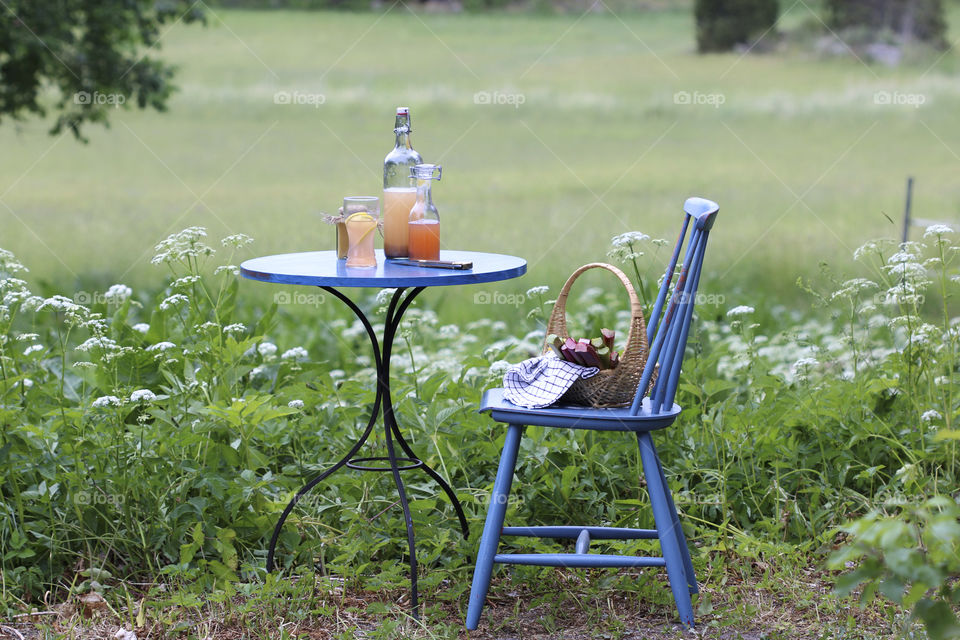 light raspberry juice and blue chair