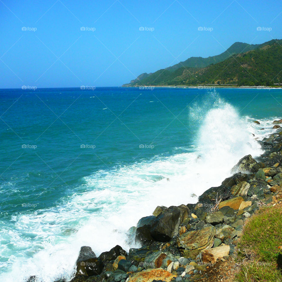 Powerful Waves from the Caribbean Sea crashing against the protective rocky shoreline!
This landscape photo was taken in Santiago de Cuba!