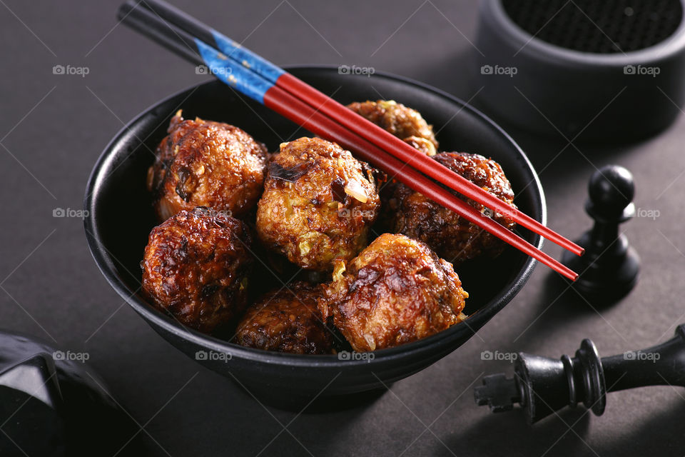Chinese food manchurian dish in a black bowl