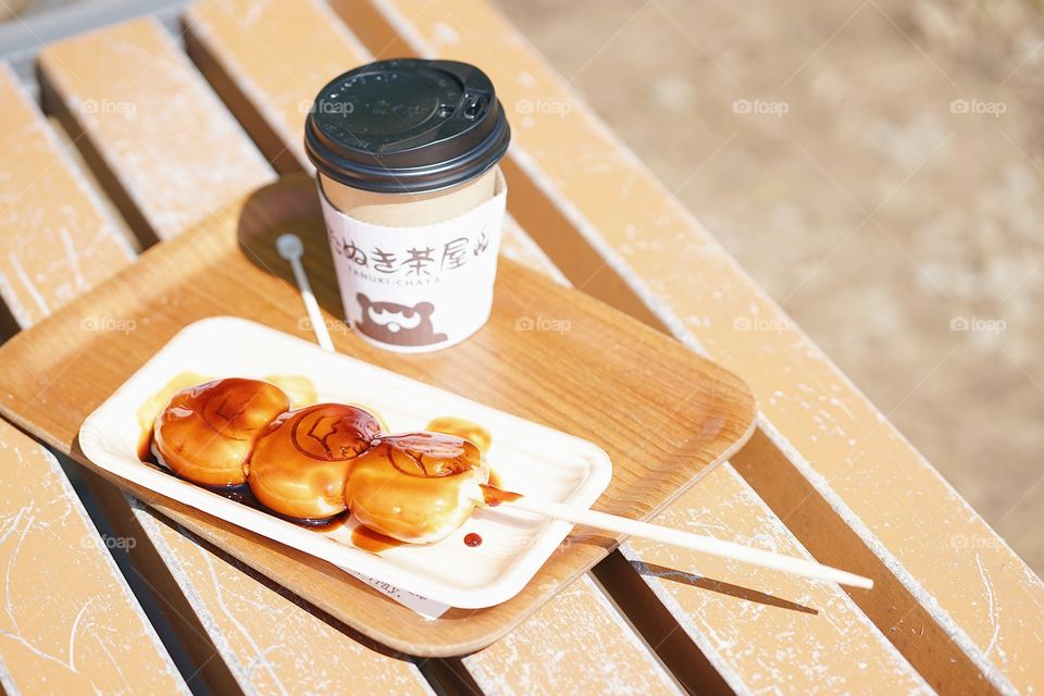 Dango and a cup of hot tea. Dango is a kind of traditional Japanese sweet. Normally it is side dish served with Japanese green tea.