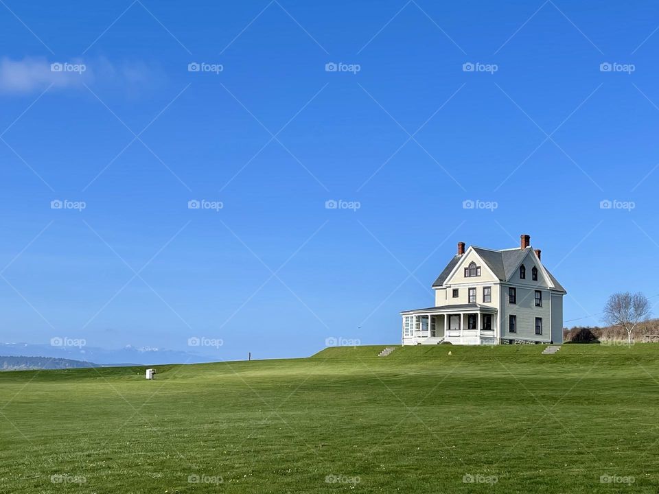 Spring landscape with lonely house 