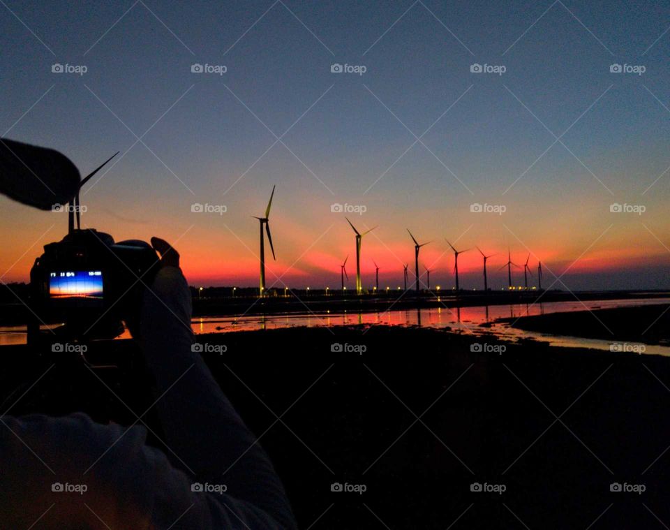 Best of the best: the crepuscular rays after sunset , and windmills, river, sky  were very beautiful.