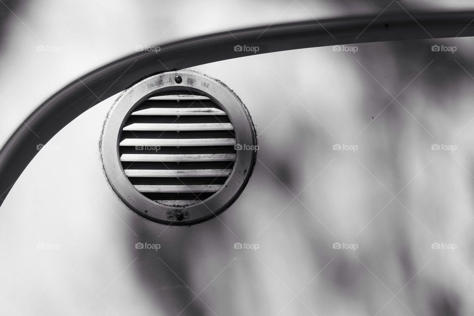 Close-up of a ventilation grille on a car