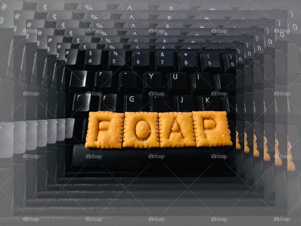 FOAP on a black keyboard spelled in orange Cheezits 