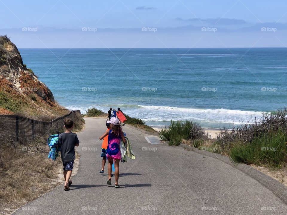 Children on their way to fun at the beach Lifestyle Photography 