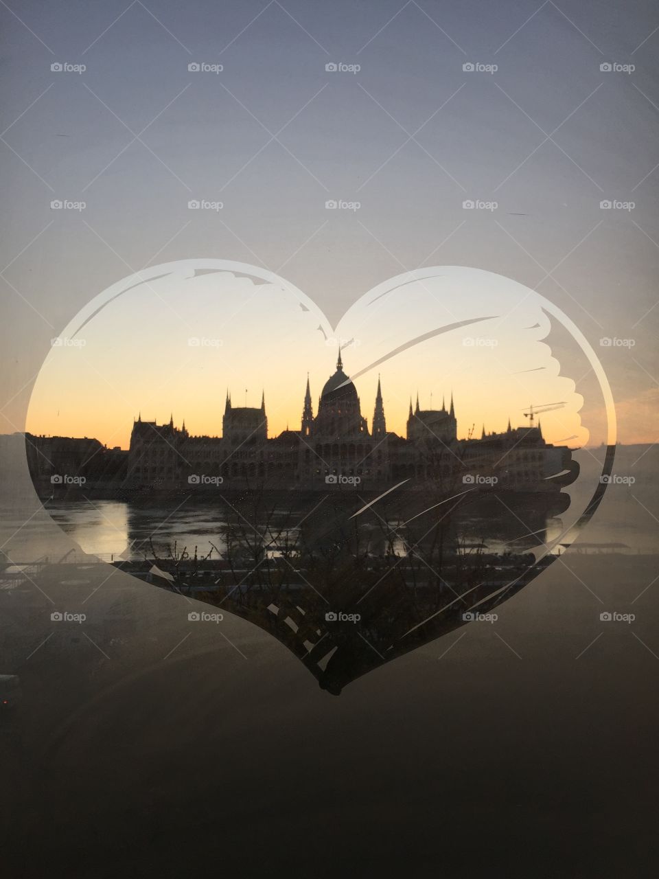 Hungarian Parliament building (Country House) at sunrise from across the Danube. 