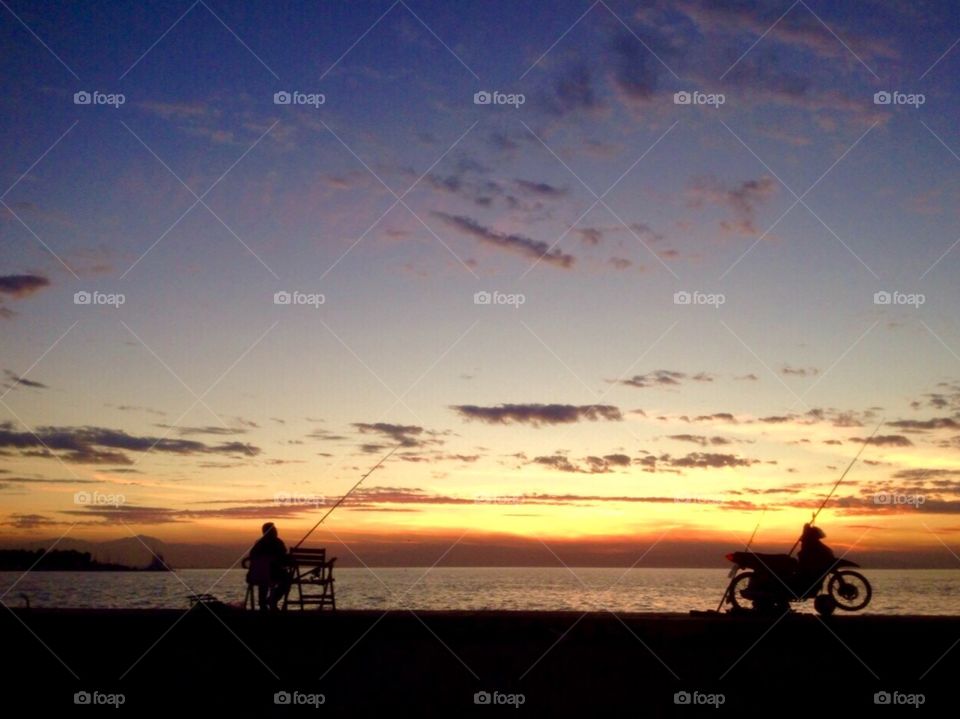 Fisherman's silhouette during sunset