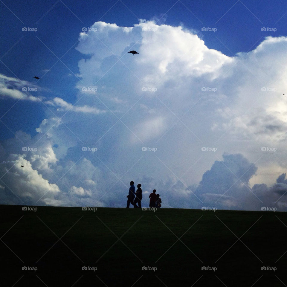 flying kites in the clouds.
