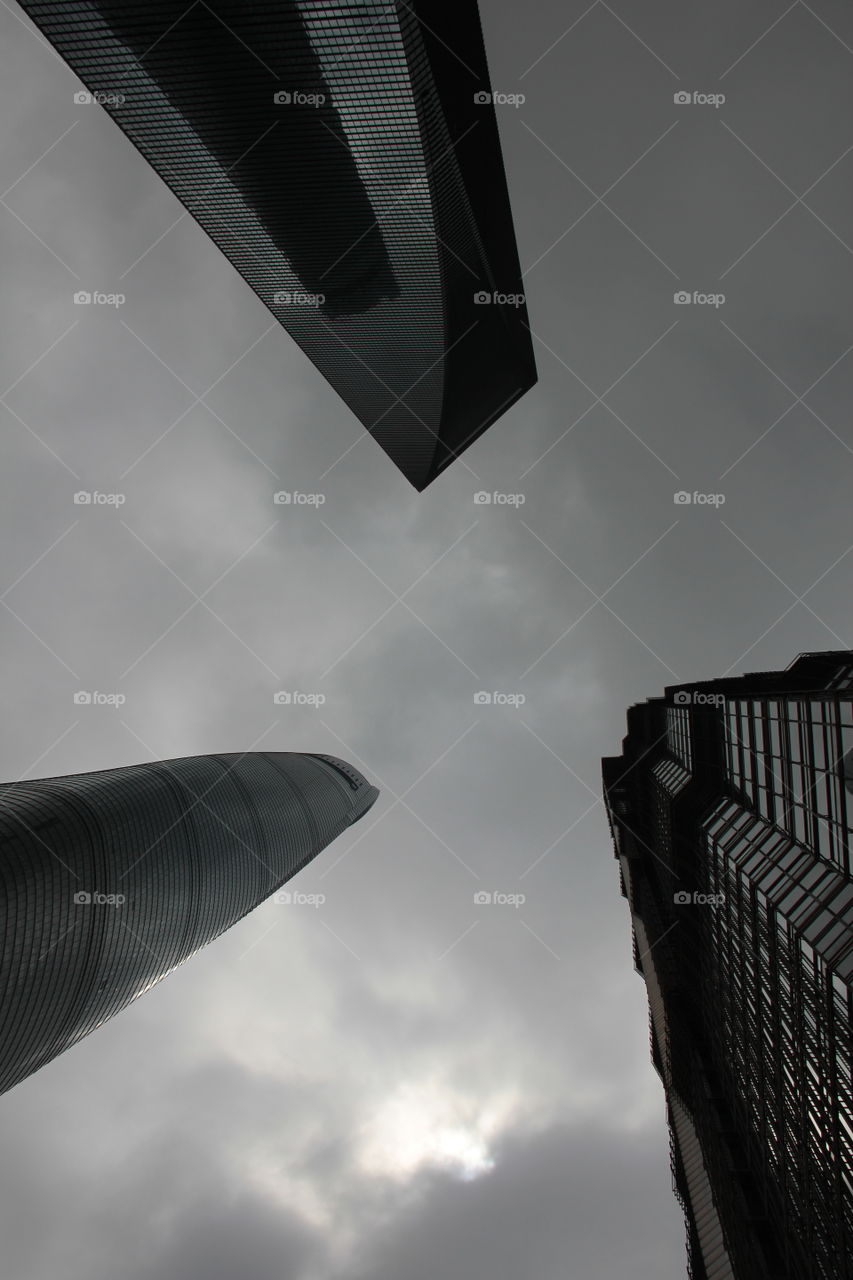 looking up in shanghai. Looking up to the three biggest sky scrapers in Shanghai, China.