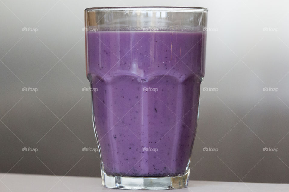 Glass of purple blueberry milk