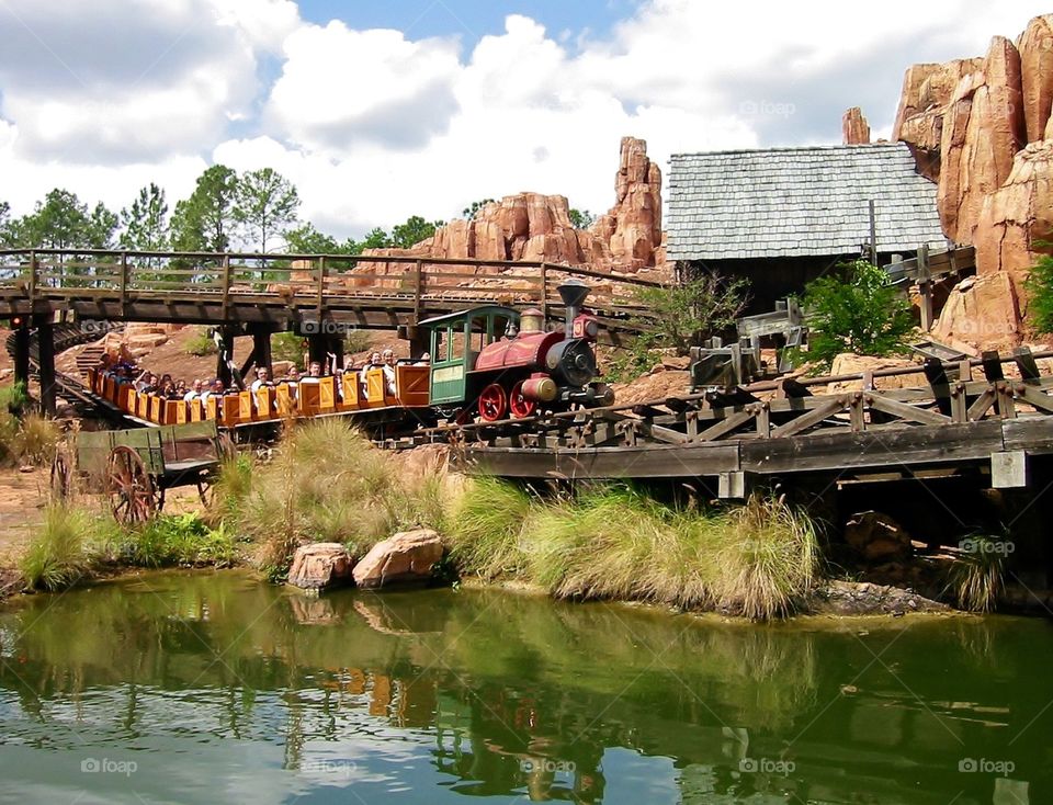 Who's up for a train ride? . Spring is best spent at Disney World - people enjoying spring mission 