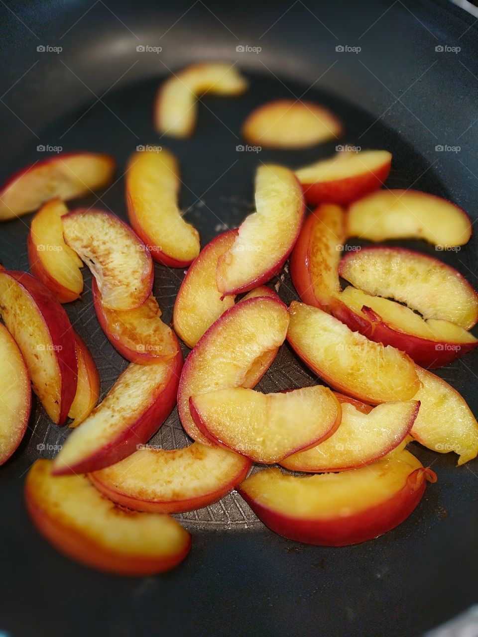 Fried peaches in the pan