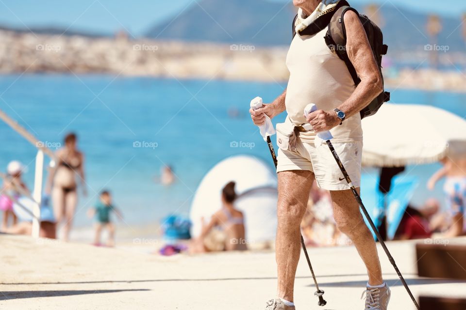 male pensioner is walking on the promenade of France