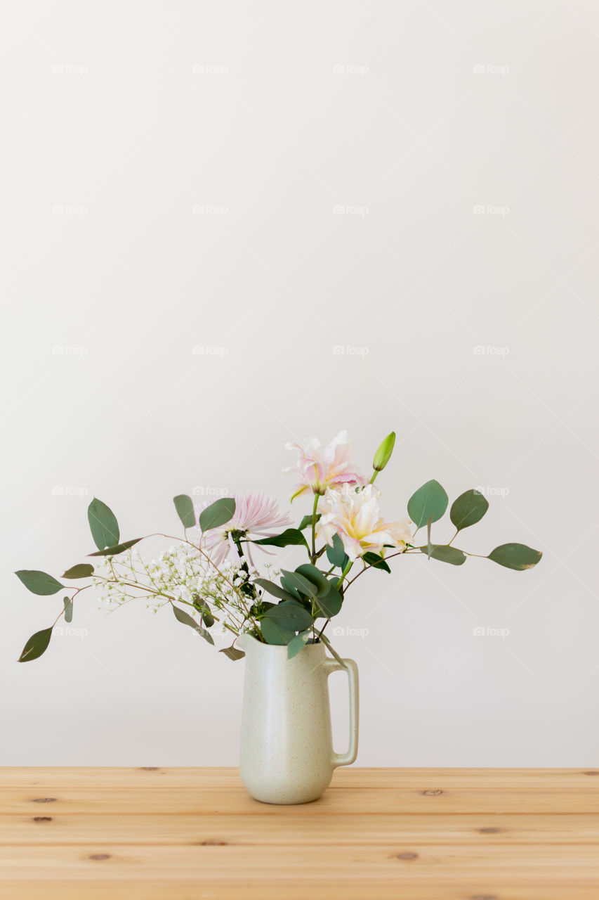Flowers on white wall