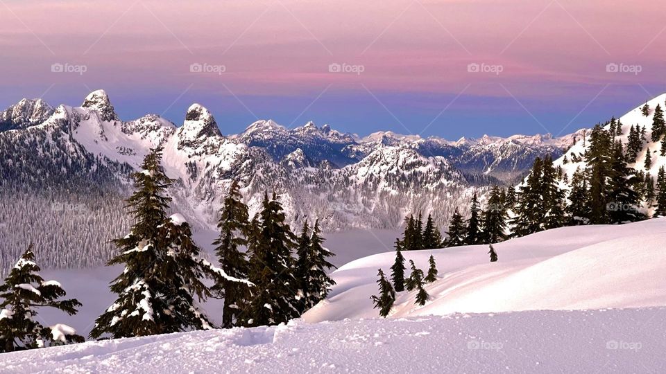 Snow mountain and beautiful sunset 