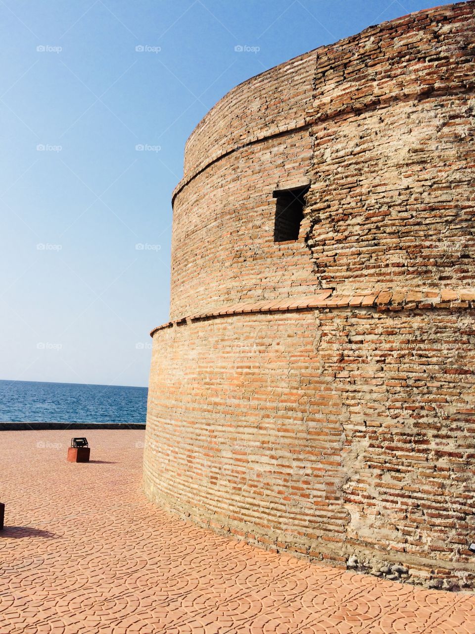 the historical tower along the beautiful sight of the ocean.