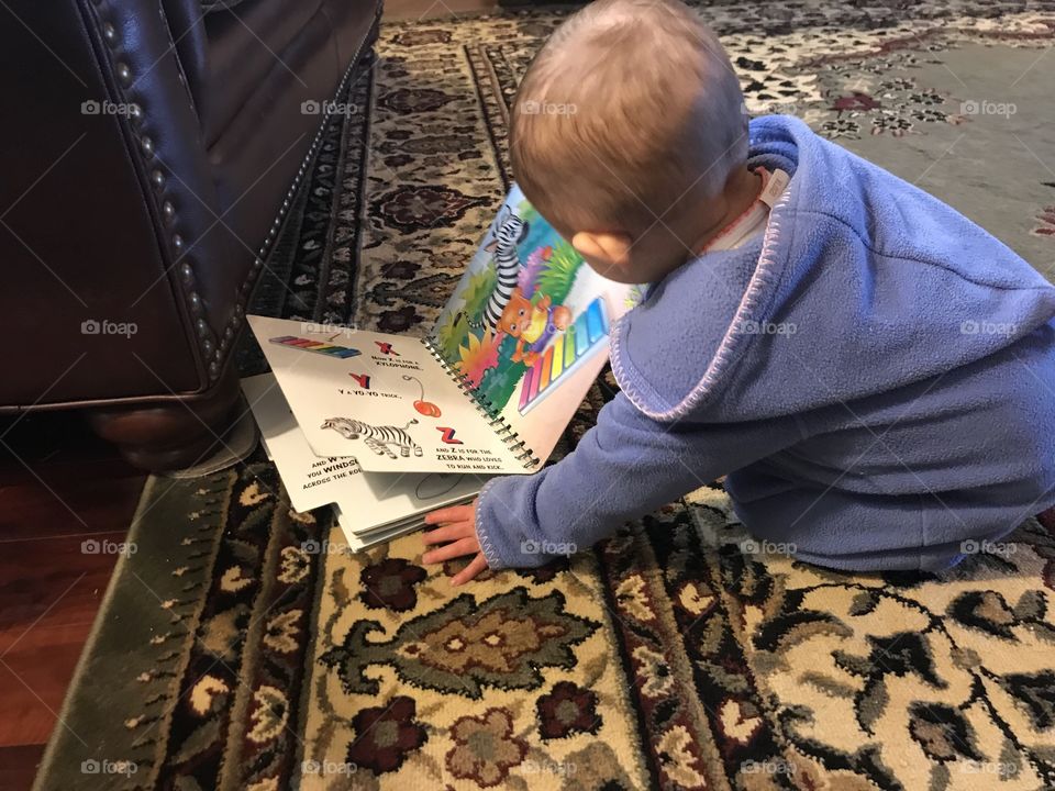 Baby exploring book