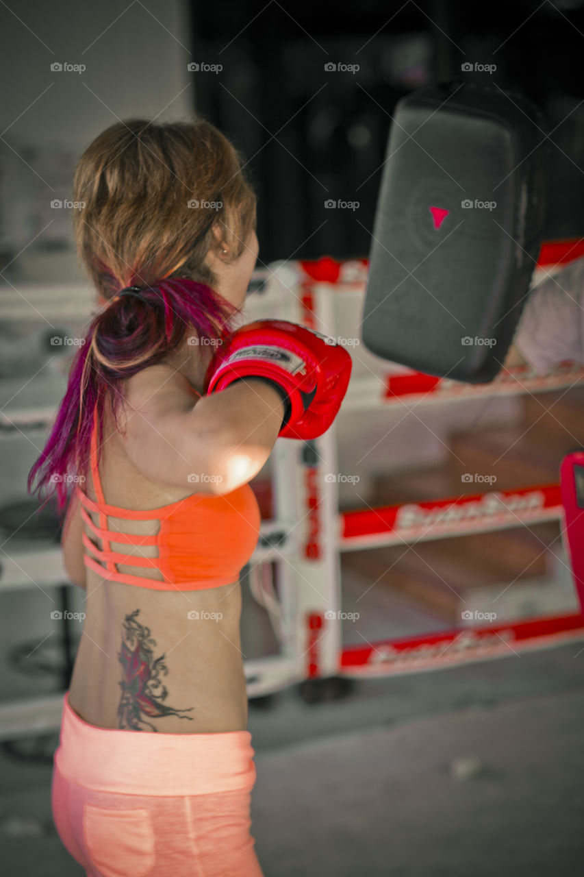 woman punching at boxing training. Muay Thai training