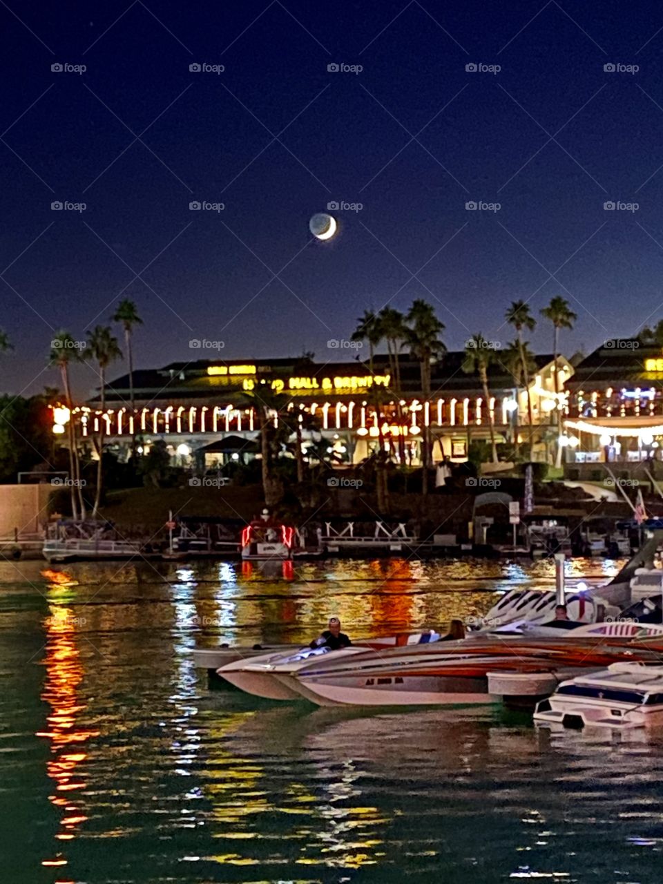 Moon shining over Lake Havasu City Arizona while walking along Shoreline Trail 