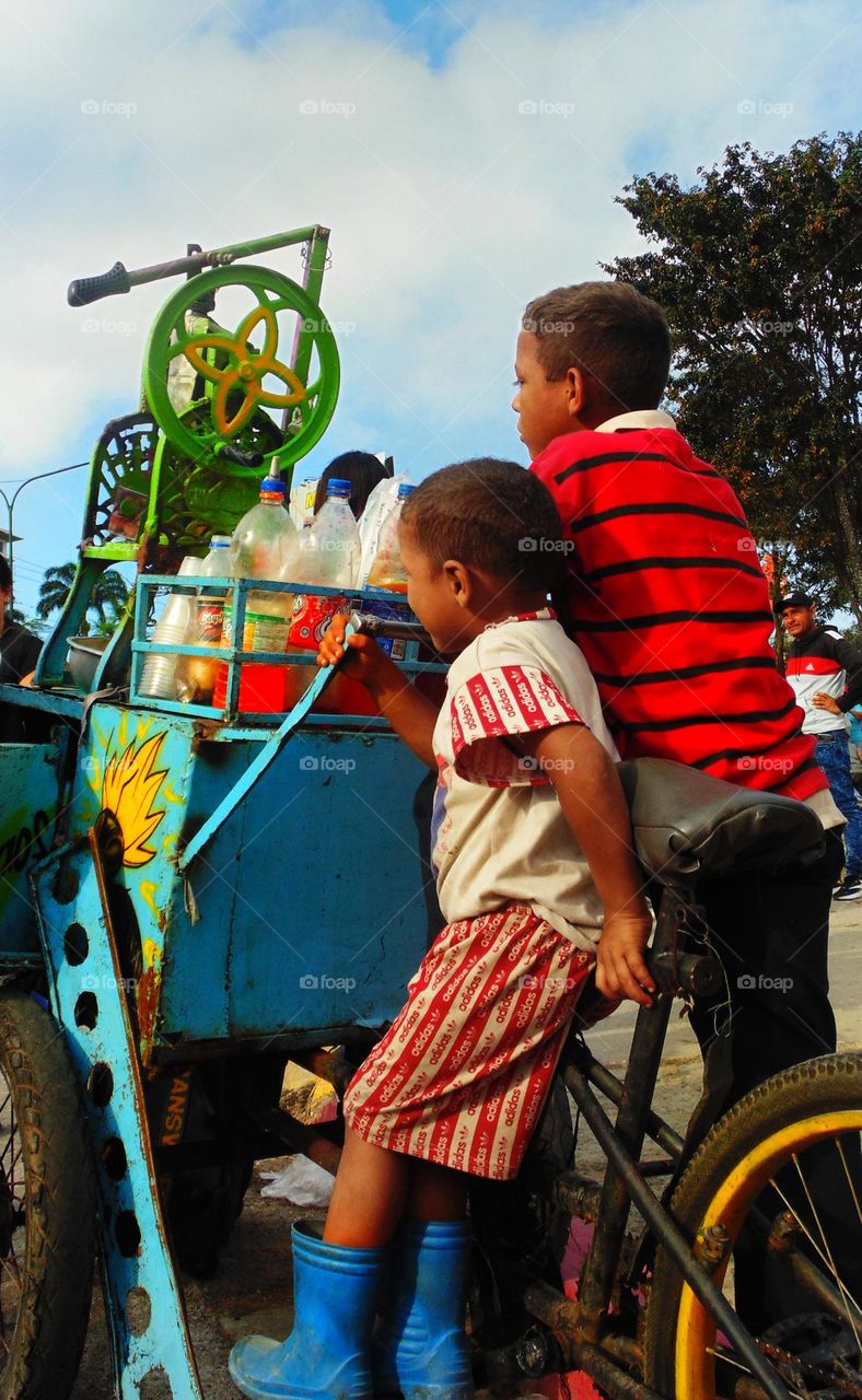 the father working and the children having fun