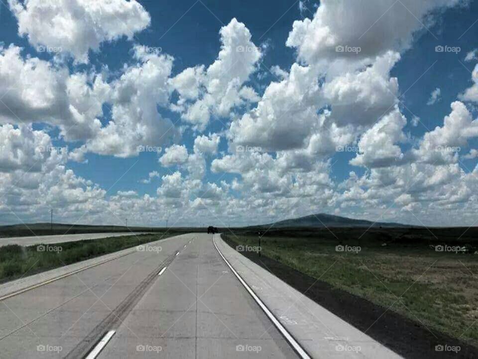 Chasing Clouds. On the highway between Clayton,  New Mexico and Raton, New Mexico 