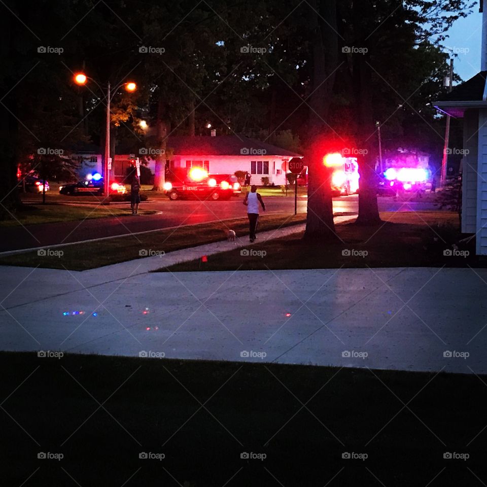 Police, emergency vehicles and fire truck at night outside of our neighbors house in Ohio 