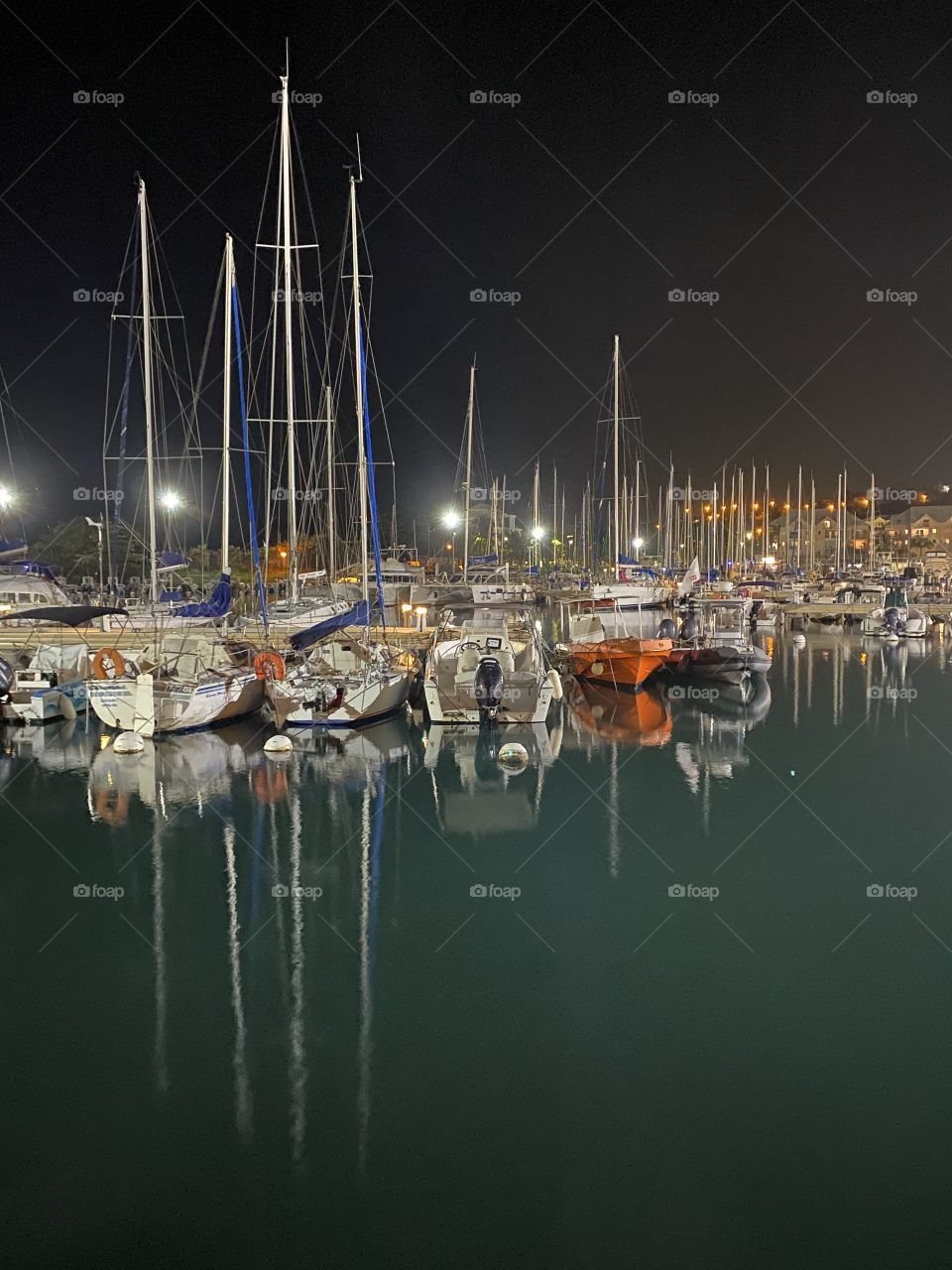 Marina night view with reflections in the water