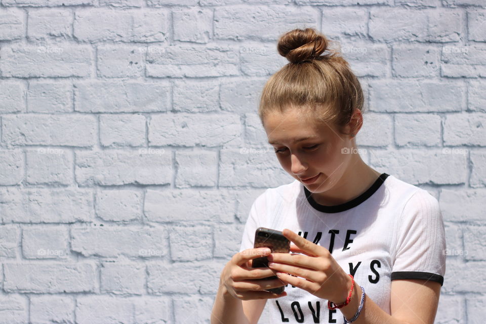 Young woman using cellphone