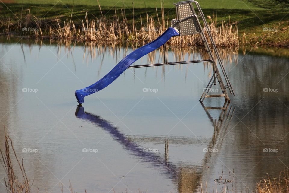 Slide into a small lake and reflection