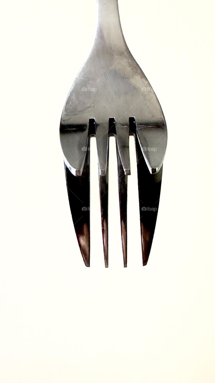 Stainless steel fork mirroring.